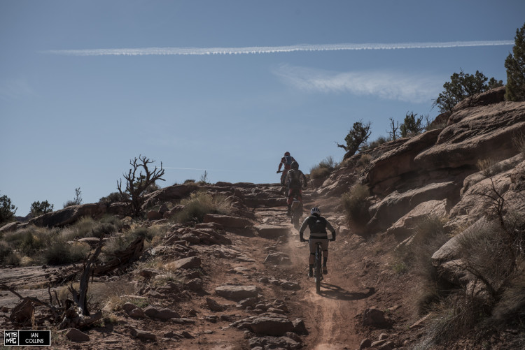 Sam Benedict from Specialized chases down a couple of motos on Amasa Back